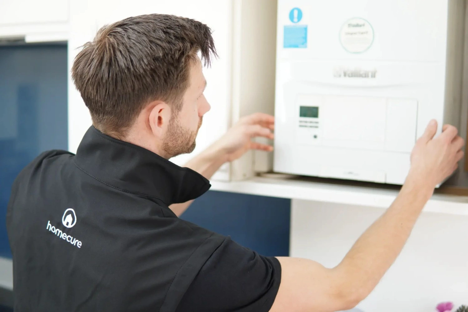 Homecure engineer doing a boiler-service in Crouch End