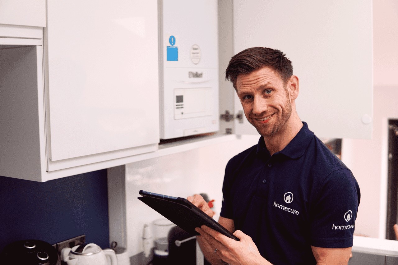 Romford Plumber inspecting a boiler